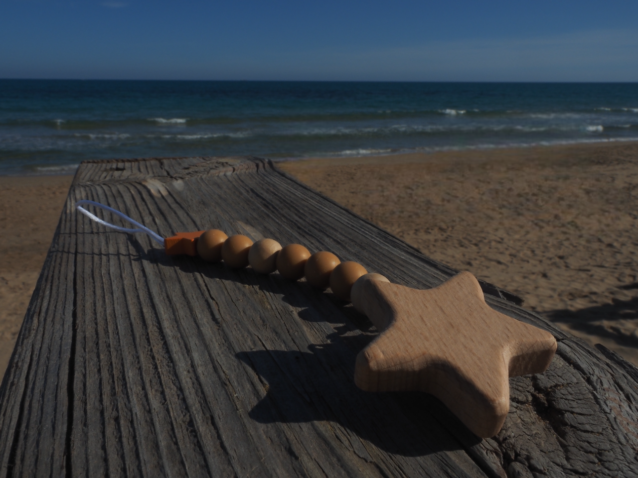 Chupetero estrella naranja