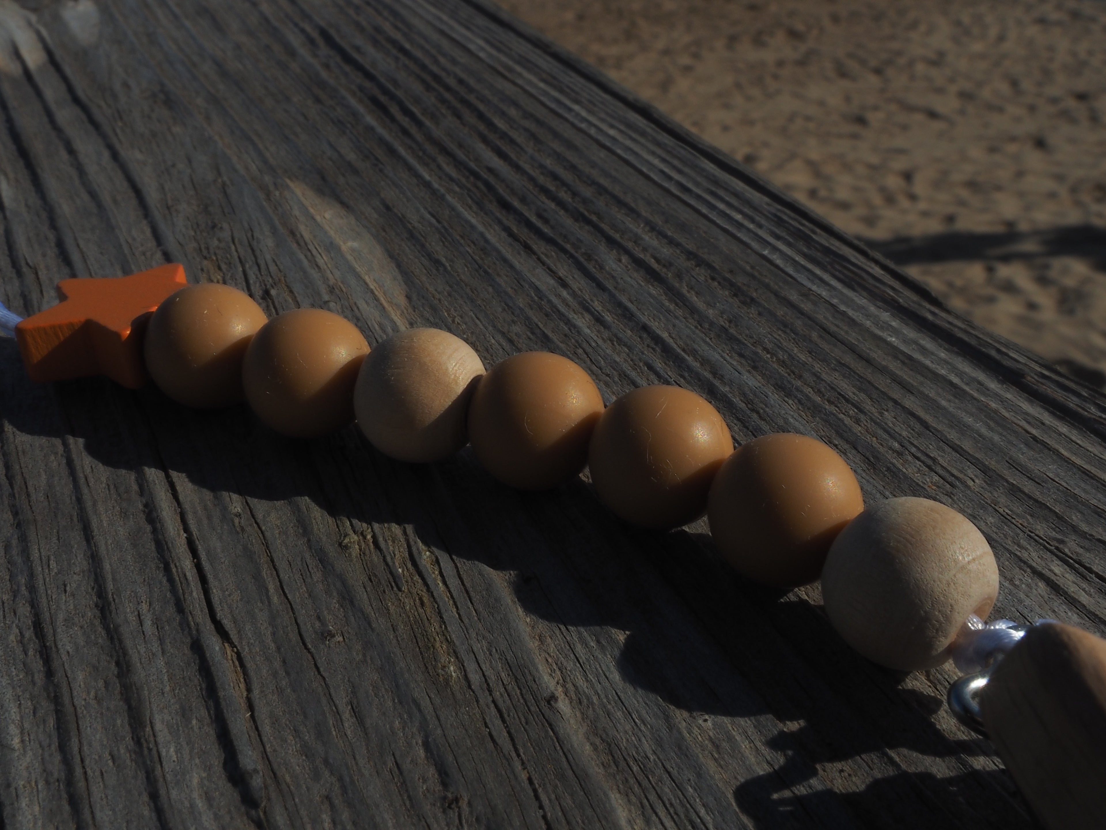 Chupetero estrella naranja